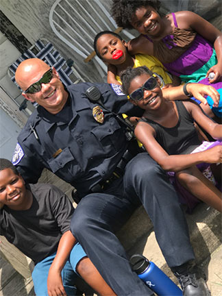 Officer Norman uses social media [Twitter, Facebook, and Instagram] and a variety of ways to inspire the world, a world where too often police are seen in a negative light with brutality, abuse of force and poor relationships with citizens.